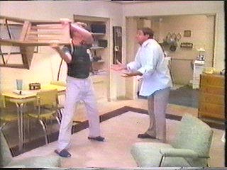 [Hammer swinging chair to hit Raker]