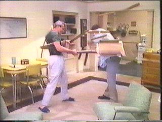 [Hammer hitting Raker with chair]