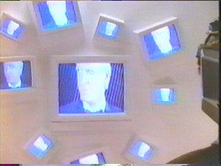 [the many monitors in the white room]