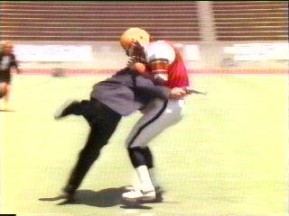 [Hammer tackling football player]