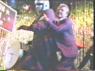 [Sledge trying to hang on to cyborg]