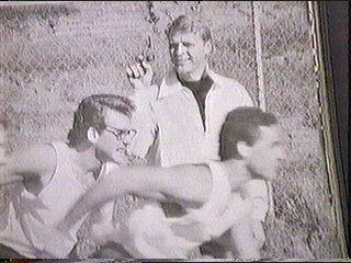 [a young Sledge firing the track starting pistol]