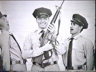 [a young Sledge holding a weapon in ROTC]