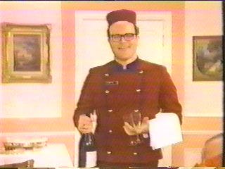 [bellboy offering champagne]