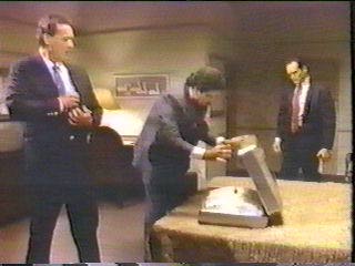 [three men with suitcase of drugs]