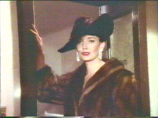 [Mrs. Carstairs standing by the door]