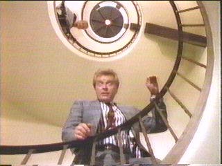 [Sledge looking down staircase]