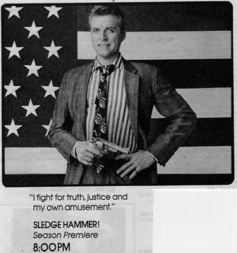 [Sledge with gun in front of American flag]