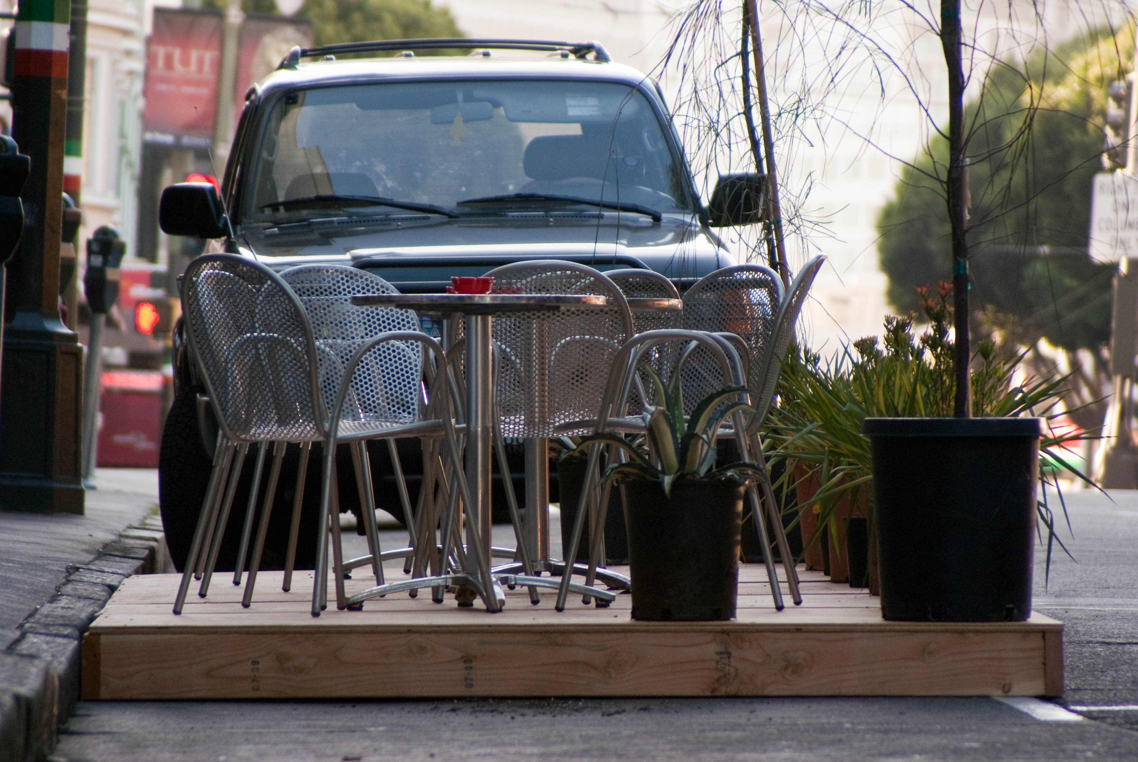 09377 Seating for nine at Caffe Roma Park(ing) Day spot in front of seating for four
